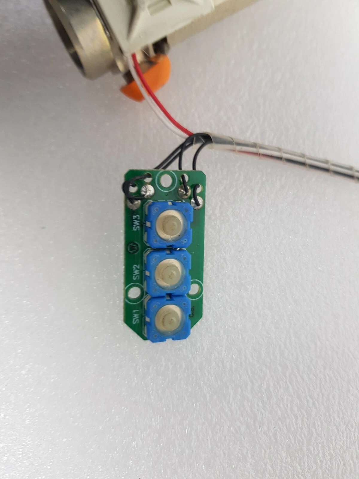 Three blue push switches SW1, SW2, SW3 on the Lumenis PC6537010 board
