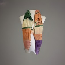 This silk scarf features a vibrant, multi-colored Square Art panel design EUC