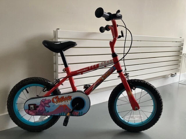 Kids Bike Apollo Dinosaur 12 inch wheels. With Stabilizers. Good condition