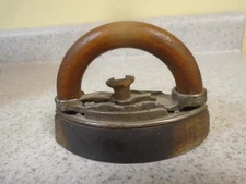 Antique ..very old small cast iron /shaped wooden handle..