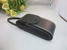 Black vinyl camera hard case with white stitching