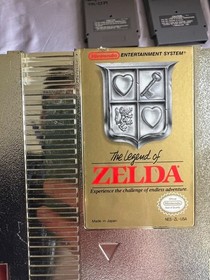 NES Console (Not working) Bundle  &ndash; Includes Zapper, Game Genie, and 10 Games