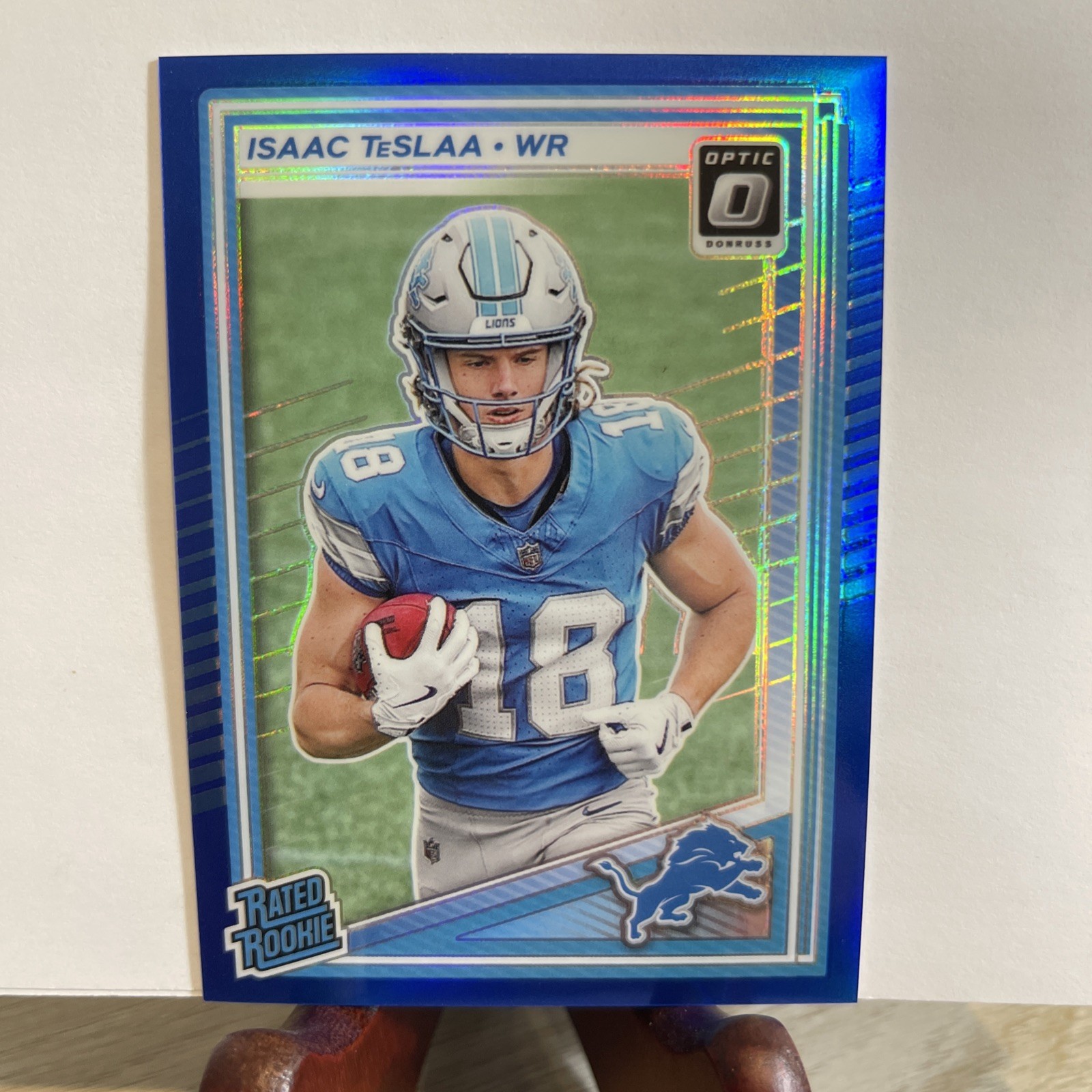 Isaac Teslaa Color Match /249 Blue Prizm 2025 Donruss Optic #219 RC Rookie Lions