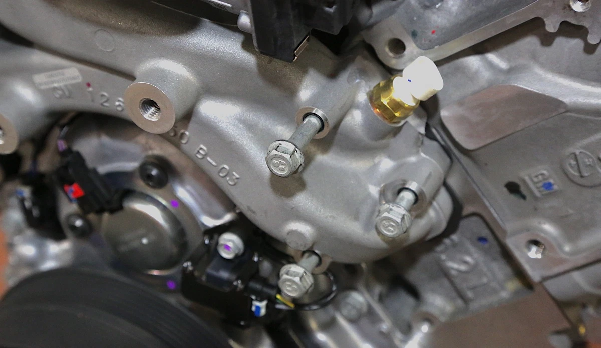 GM Gen V LT-series engine with the engine coolant temperature sensor in the water pump housing.