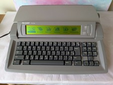 SHARP Font Writer FW-560 electronic typewriter with accessories