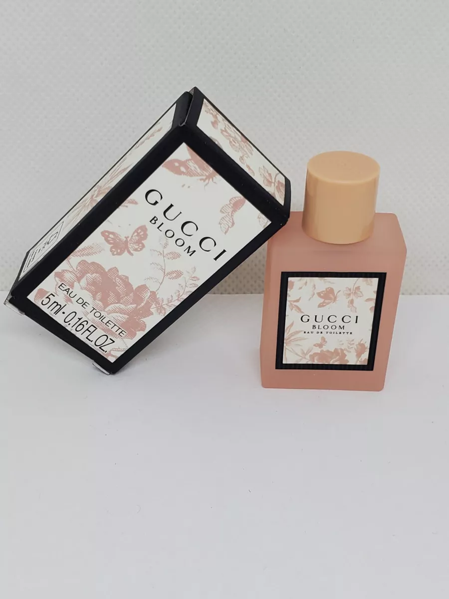 Gucci Receive a Free Gucci Bloom Pouch and Mini with any large