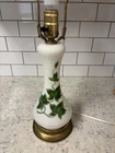 Vintage milk glass table lamp with hand-painted green ivy decoration.