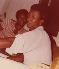 1970s Women Smiling Candid Living Room Couch Indoor Friends Over Shoulder 