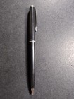 Black Eversharp mechanical pencil with silver tone trim, made in USA, displayed on a textured dark surface.