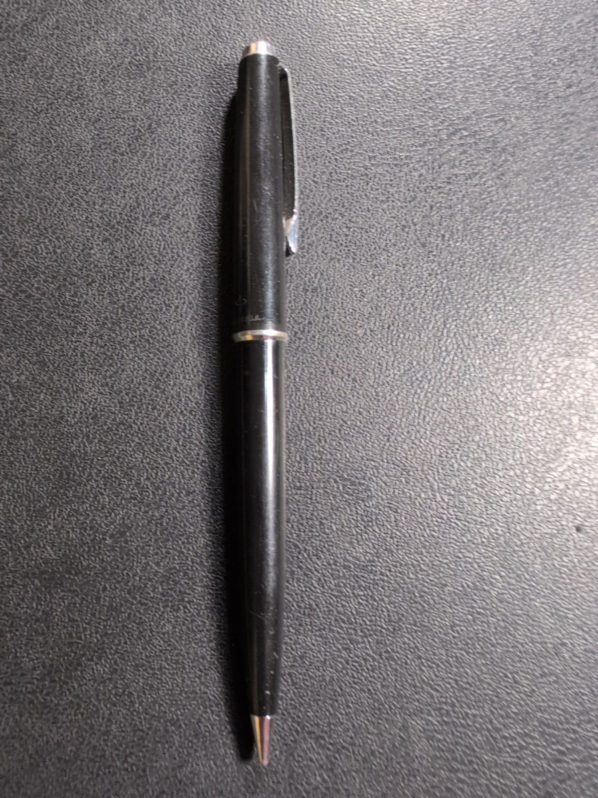 Black Eversharp mechanical pencil with silver tone trim, made in USA, displayed on a textured dark surface.