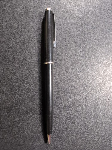 Black Eversharp mechanical pencil with silver tone trim, made in USA, displayed on a textured dark surface.