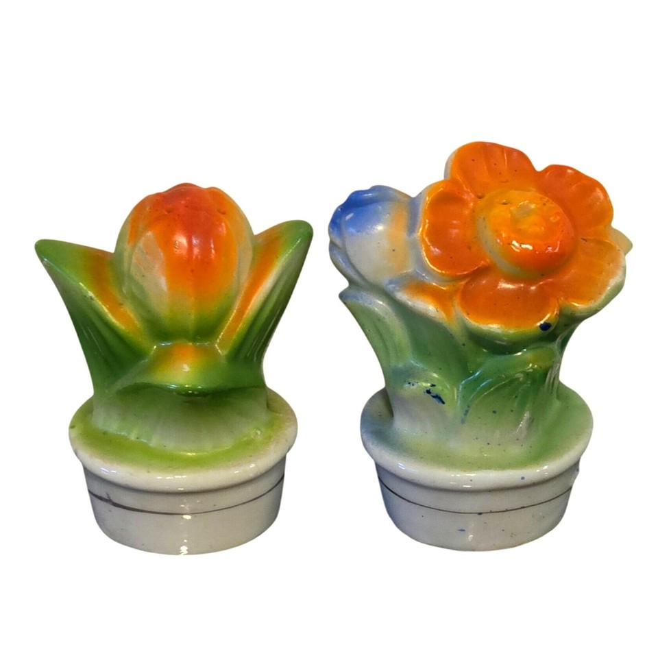 Tiny 2" 1950s Japanese ceramic salt & pepper shakers shaped like daisy and tulip flower pots — delicate, colorful, and exactly the kind of thing you stumble on and can't leave behind.