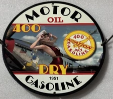 1951 AVIATION MOTOR OIL CO GASOLINE OIL GAS GARAGE PINUP PORCELAIN ENAMEL SIGN.