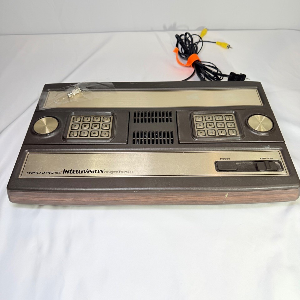 The original 1979 Intellivision with its gorgeous woodgrain shell is the kind of artifact that makes gamers and collectors do a double-take — a genuine slice of video game history.