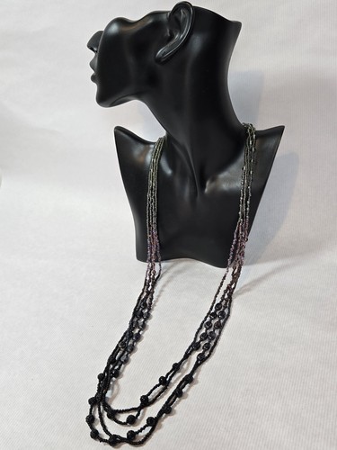 Multistranded tonal plastic beaded necklace