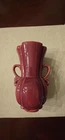 vintage burgundy pottery vase, likely produced by Shawnee Pottery or McCoy