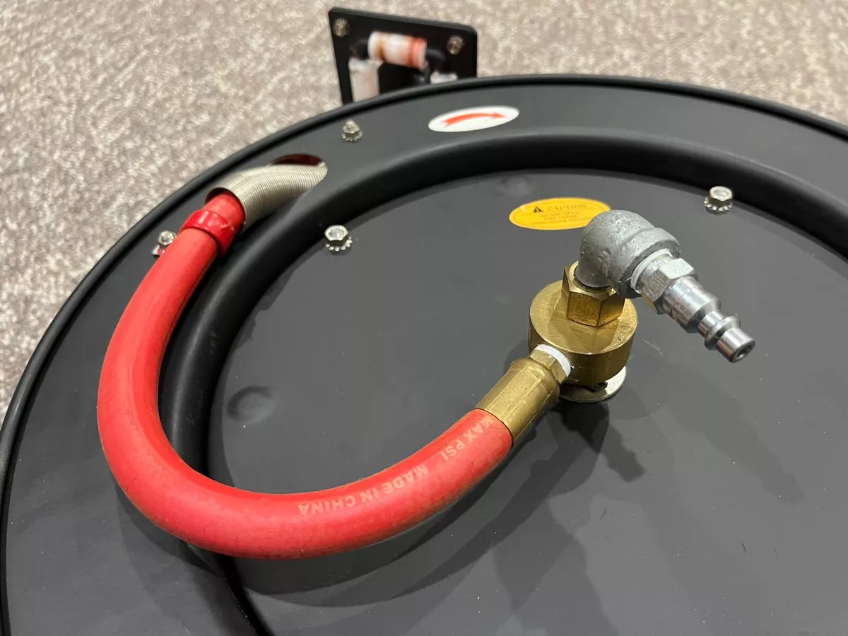 Central pneumatic retractable hose reel with 50ft air hose outlet