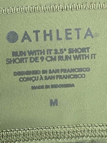 Pantaloncini corti Athleta Run With It verde oliva taglia M 3,5" cucitura interna tasca zip - Foto 6 di 8