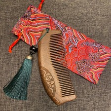 Carved Wooden Comb With Teal Tassel
