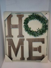 "Home" wall decor. Word "Home" with wreath as "O", other letters are wood-like