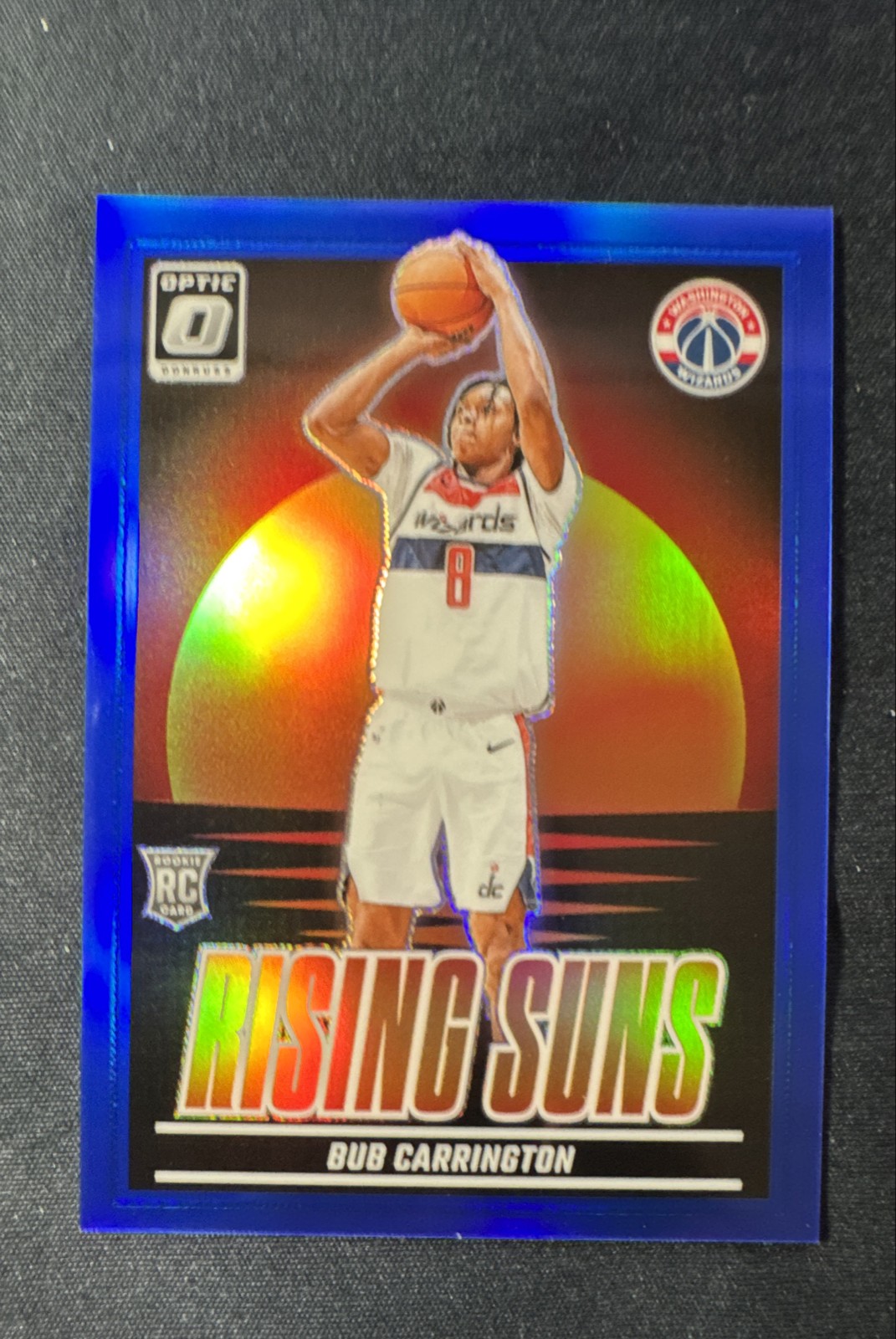 2024-25 Panini Donruss Optic - Rising Suns Bub Carrington #3 Blue Prizm /49 (RC)