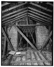 81. ATTIC - LOOKING NORTH SHOWING HATCH FROM SECOND FLOOR LADDER ROOF -