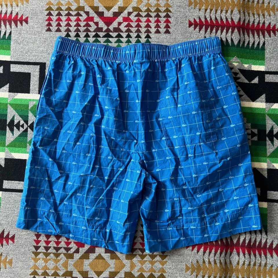 Pantalones cortos para dormir Lacoste para hombre medianos con estampado de logotipo azul bolsillos para salón C6 Foto 2 de 4