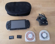 Sony PSP-1000 Black Handheld Console Bundle w/ Case, Charger, Memory Stick Duo