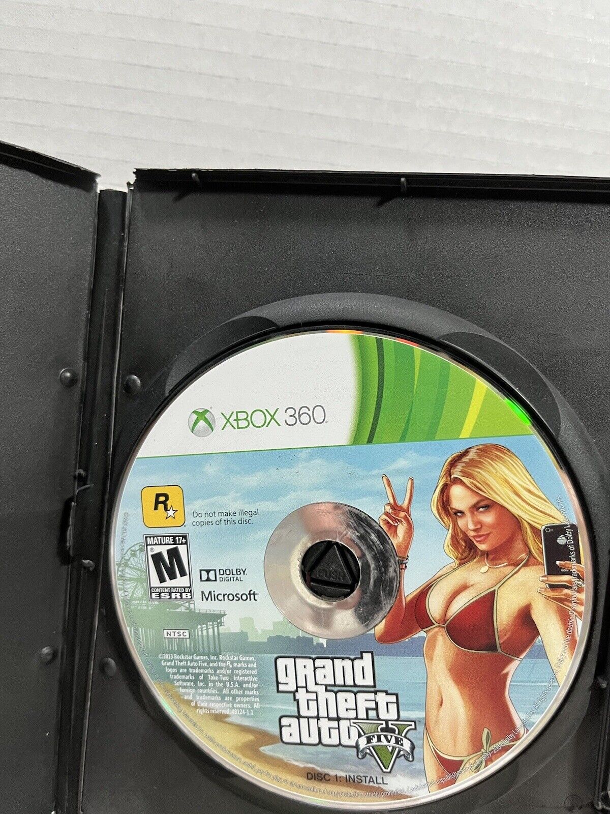 GTA V Install Disc frozen. I recently got an Xbox 360 along with GTA V for  it, and when I used the install disc it keeps getting stuck on that screen.  Does