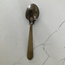 Brass vintage tea-steeping spoon