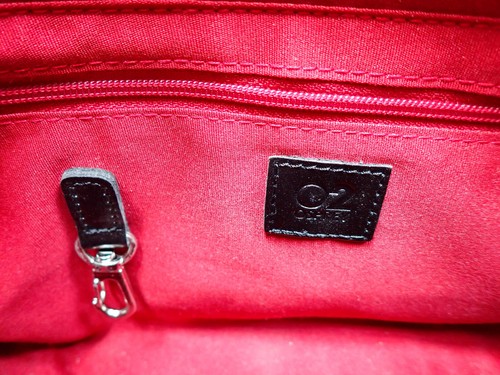 Osprey O2 clutch bag; black embossed floral patterning and red lining; no strap. - Picture 2 of 6