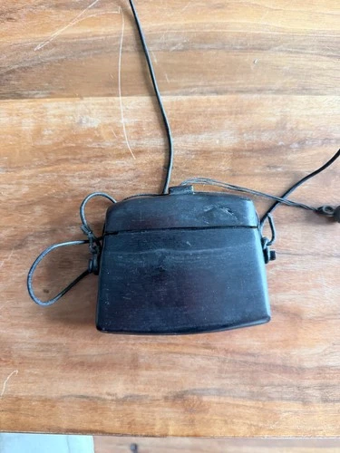 Small carved wooden box with a cord for holding tabacco and keepsakes