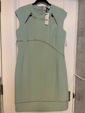  Versace collection light green dress with front cut outs and gold studs