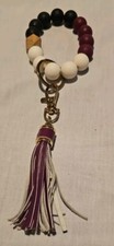Black, Purple And White Wooden Beaded Wristlet Keychain With Tassel