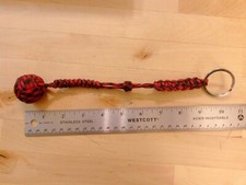 Woven Paracord Sphere Black  red with keyring and decorative knotting.