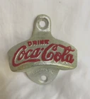 Coca-Cola vintage Starr X wall-mount bottle opener, silver, red lettering, USA