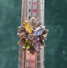 vintage sterling silver cocktail ring featuring multiple marquise-cut gemstones,