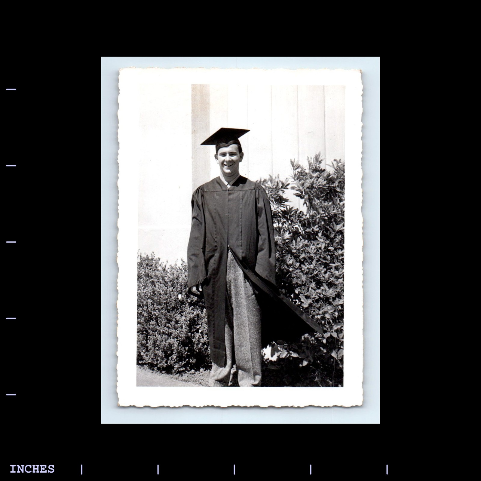 Vintage Black and White Man in Graduation Cap and Gown Photo