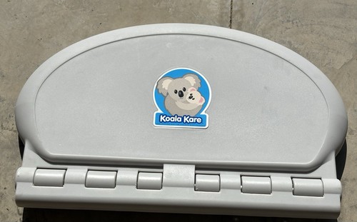 UNUSED Koala Kare KB208-01 Wall Mounted Baby Changing Station - Oval BCS Grey