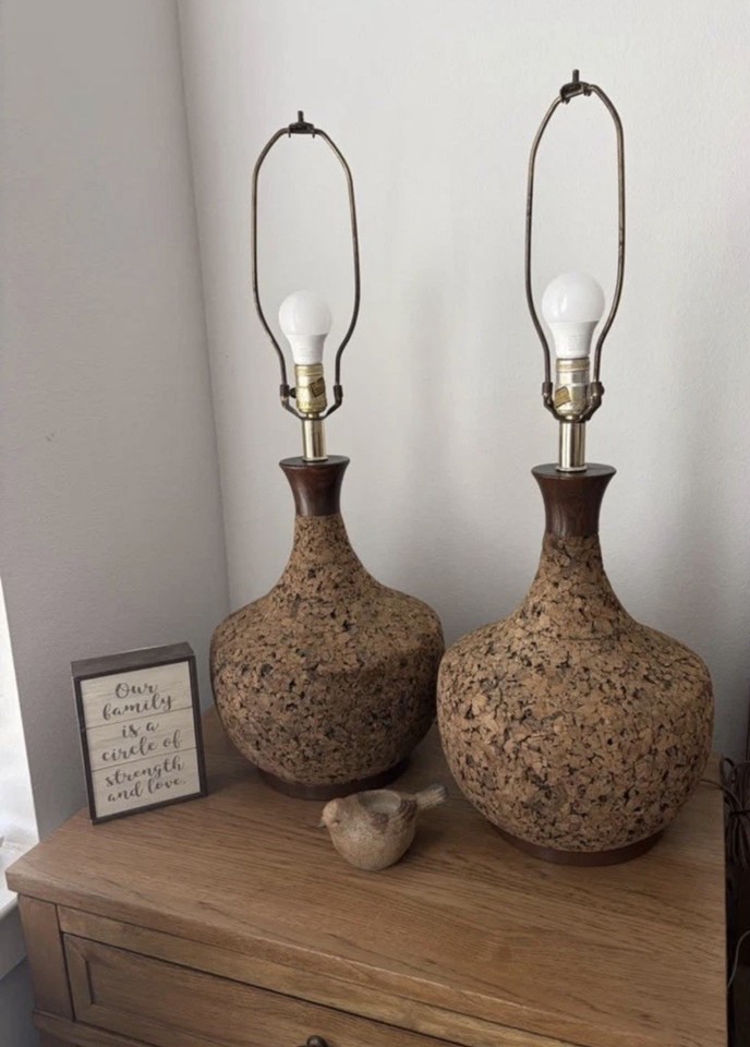 A large pair of 1960s cork-and-brass Danish Modern table lamps — cork as a lamp material is an unexpected textural flex that reads as instantly cool.