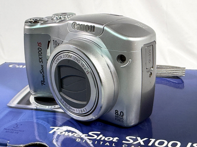 Canon PowerShot SX100 IS 8.0mp 10x Zoom Compact Camera Silver 2 mb