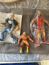 (3) WWE Wrestling Action Figures Stone Cold Steve Austin/Kurt Angle/Hulk Hogan