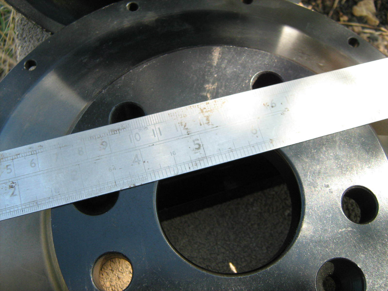 API 390mm rotors with custom Ferrari pattern hats and caliper mounts for Brembo