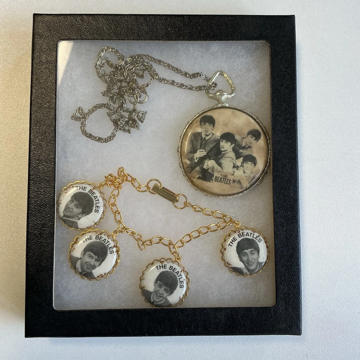 Preços baixos em Pulseira de Berloque dos Beatles em Outra
