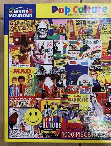 White Mountain POP CULTURE 1000 piece puzzle box with colorful vintage ads and logos on a yellow background.