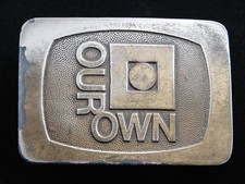 RF09164 VINTAGE 1970s OUR OWN ADVERTISMENT BELT BUCKLE