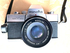 MINOLTA SRT 100 35MM Film Camera With Minolta 1:2 f/50mm MC Rokkor-PF lens Strap