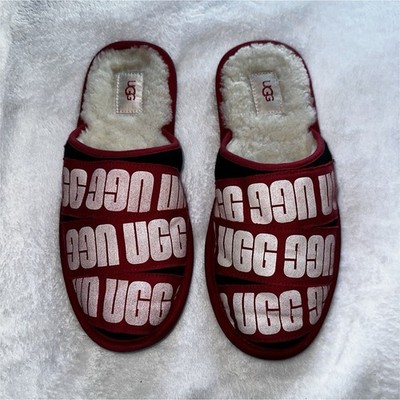~UGG slippers with white 'UGG' text repeating on a red background    ( Used)