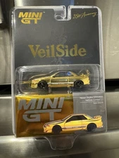 MINI GT VeilSide Nissan Skyline GT-R R32 35th Anniv. Combat C-I Gold Chrome 1/64