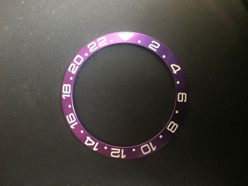 ONE PURPLE ALUMINUM BEZEL INSERT WITH 